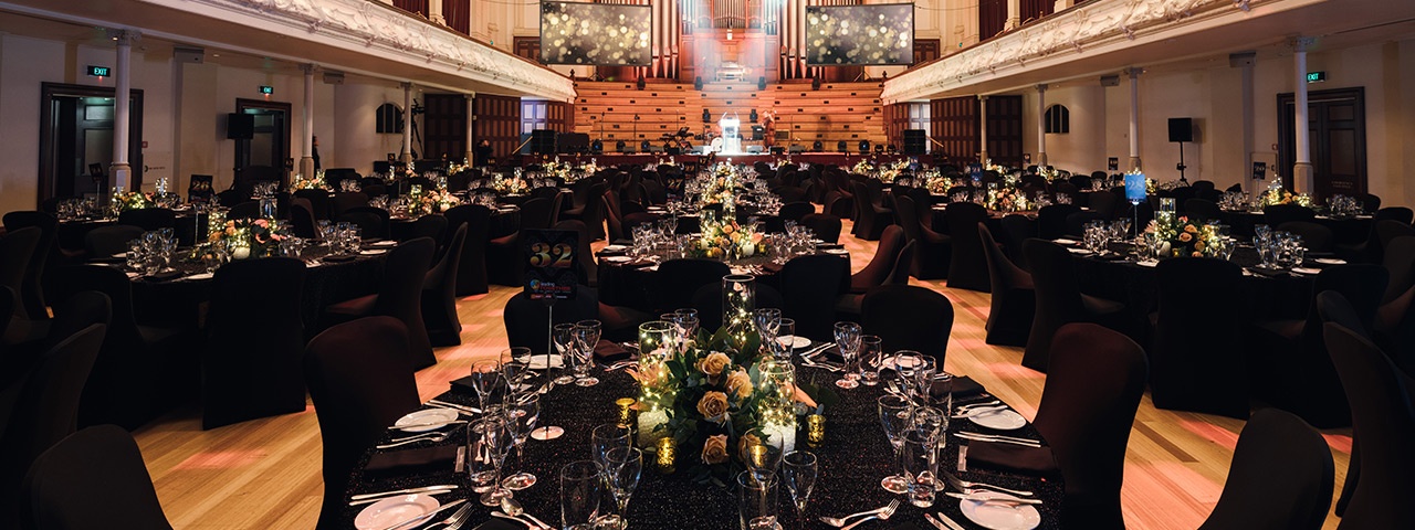 Auckland Town Hall's great hall set up for a banquet dinner.