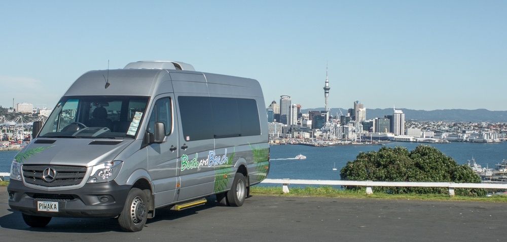Van in foreground, Auckland city in background