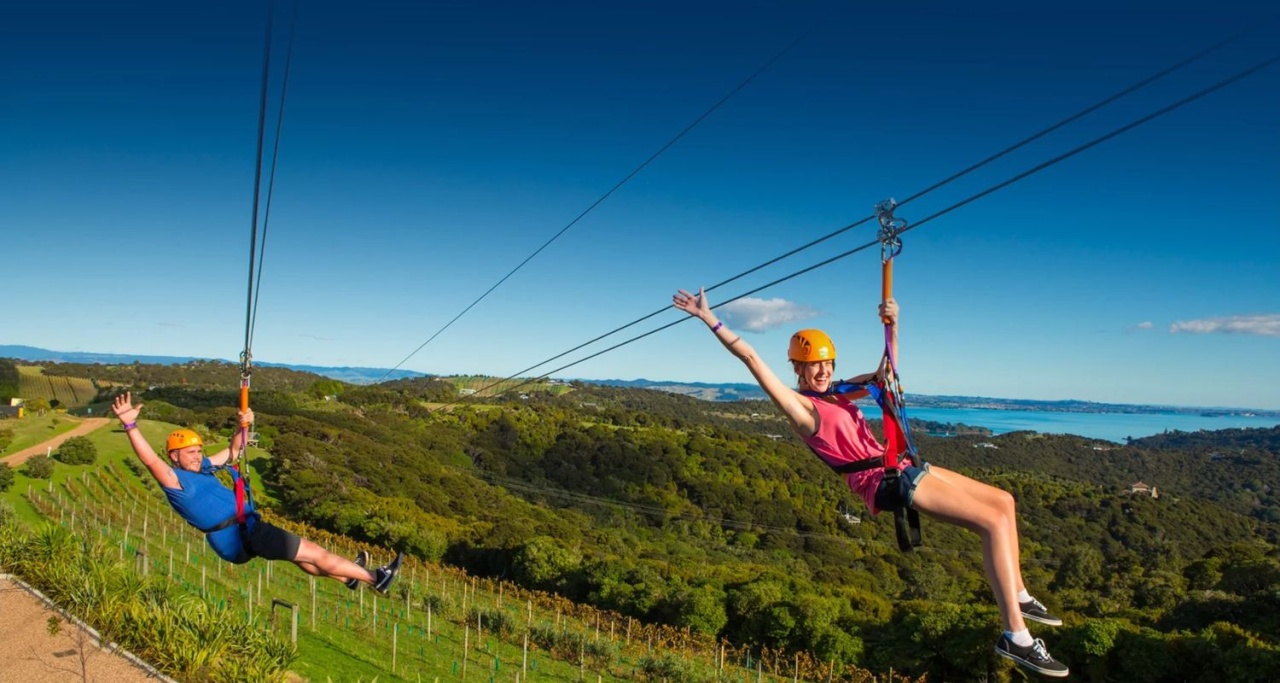 Two people on the EcoZip Adventures zipline