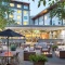 Outdoor acacia garden at the Ibis Auckland Ellerslie hotel.
