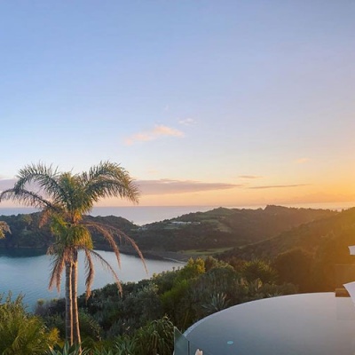 View from the top of Delamore Lodge over the infinity pool and ocean and island views